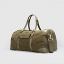 Dark olive suede duffle bag for travel featuring leather trims, detachable straps, handles, flap pocket, and gold hardware