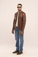 Man wearing coffee brown genuine leather Biker Jacket with a front zipper, quilted shoulders and multiple zipper pockets
