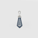 Deep blue textured leather key charm for men with elegant bell-shaped cover and pull-up ring, plain background
