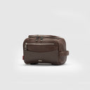Coffee brown leather toiletry bag featuring texture detail, zippered compartments, logo plate, and handle, travel kit for men