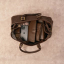 Coffee Leather Weekender Bag Showcasing Spacious Interior Storage.