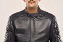 Close-up of man wearing navy blue lamb nappa leather jacket, diamond-quilted pattern on shoulders and snap-button collar.