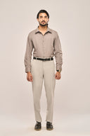 Man wearing gray pleat shirt with fine front pleats, full sleeves and slim fit, paired with light trousers and black belt.