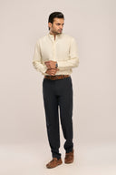 Man wearing butter yellow mandarin collar shirt with full sleeves and button-down front, worn with black pants & brown belt.