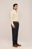 Side view of man in yellow mandarin collar shirt for men showing relaxed fit and full sleeves, worn with black pants.