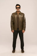 Man wearing dark olive leather jacket for men, regular fit, zip closure, structured panel, paired with black pants