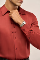Close up of a man in rust red lyocell shirt for men featuring full sleeves, and unique button loop detailing.