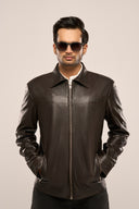 Man wearing structured black leather jacket for men, featuring front zipper, full sleeves, slip-in pockets, with sunglasses