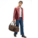 Lifestyle Image Of The Brown Premium Leather Travel Duffle Bag. 