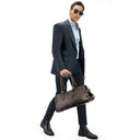 Model Carrying The Coffee Weekender Premium Leather Travel Bag.