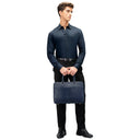 Model Carrying The Navy Blue Quantum Premium Leather Briefcase. 